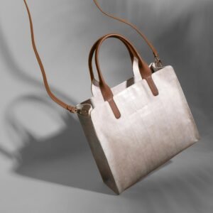 Luxury crocodile leather handbag in a studio shoot showcasing elegance and style.